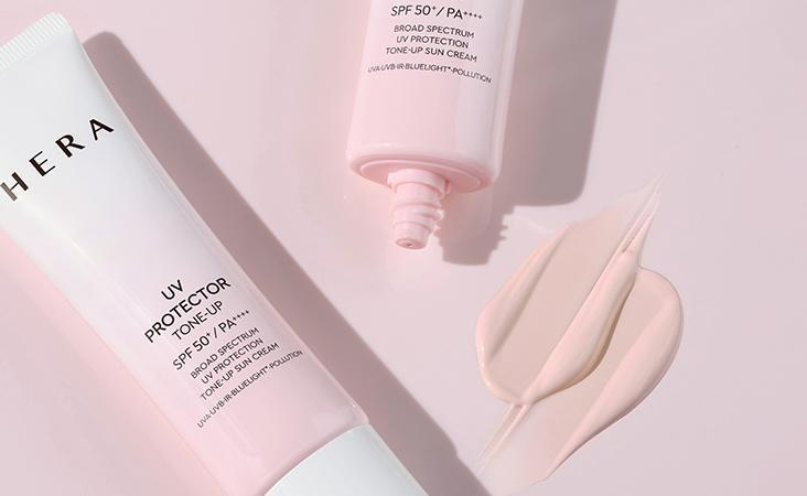 HERA UV Protector Tone-Up SPF 50+ PA+++ broad spectrum sunscreen with pink fluid texture and no white cast