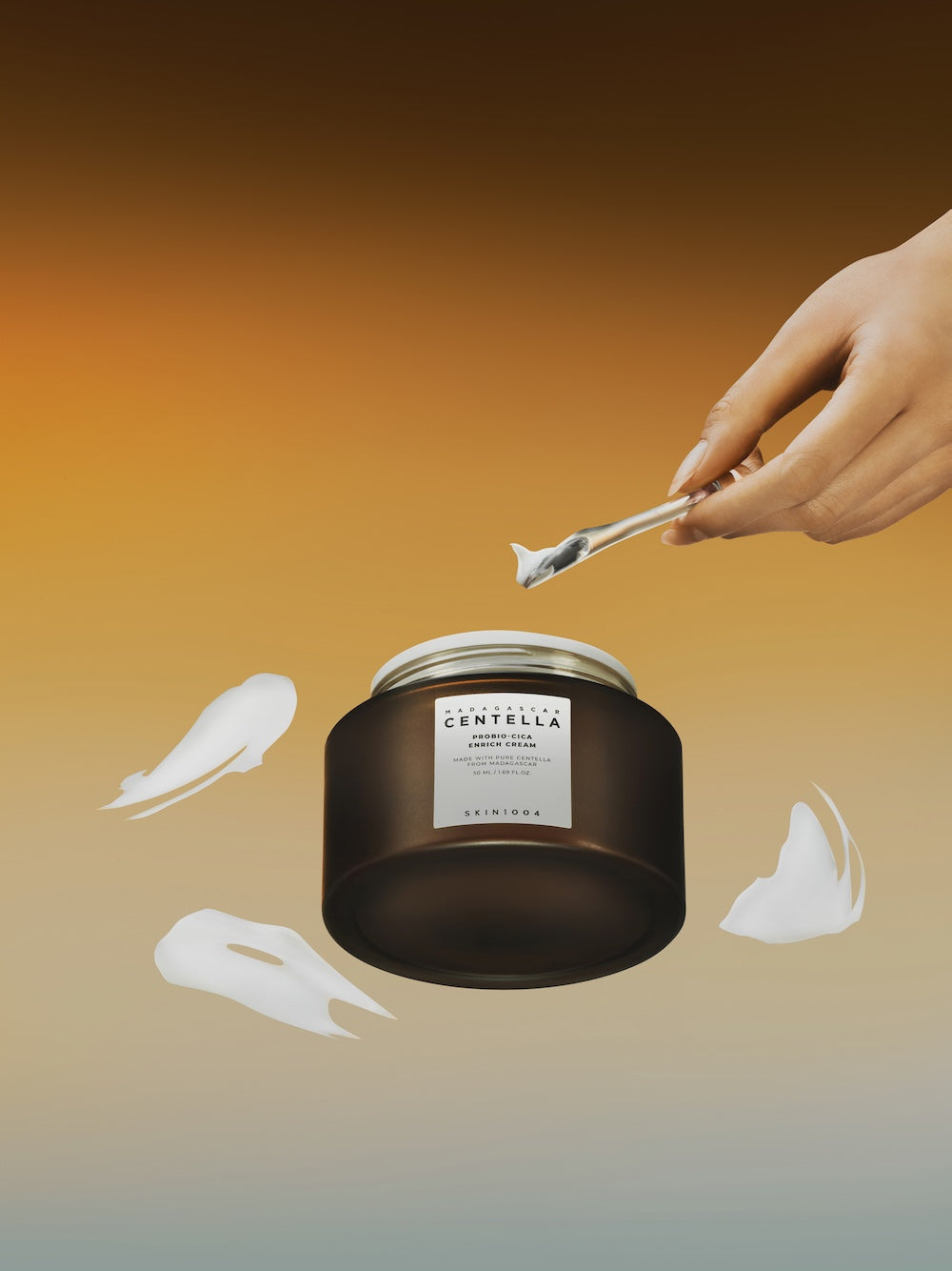 Madagascar Centella Probio-Cica Enrich Cream jar with creamy texture and applicator spoon